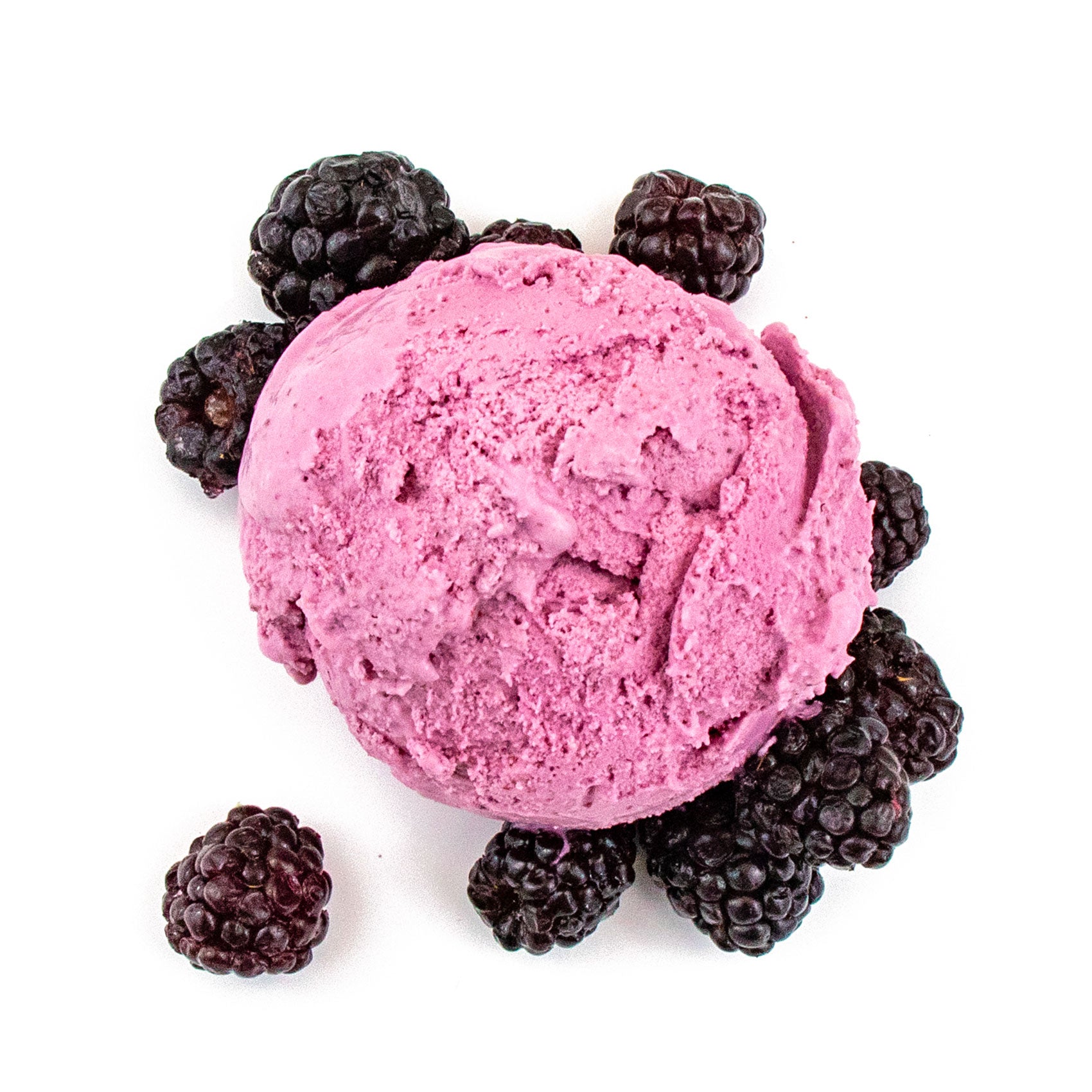 Black raspberr ice cream scoop surrounded by blackberries on a white background