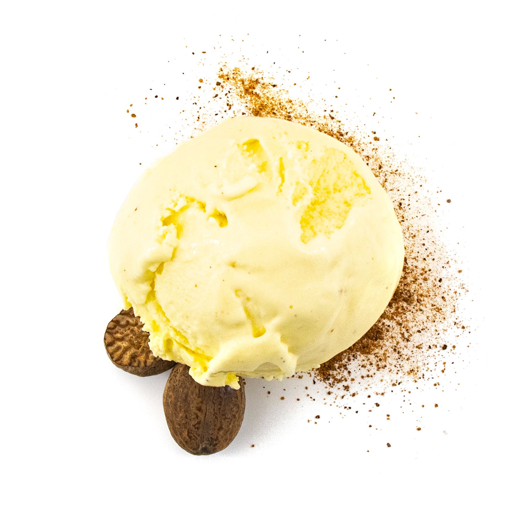 Egg nog ice cream scoop with cookies and spices on a white background