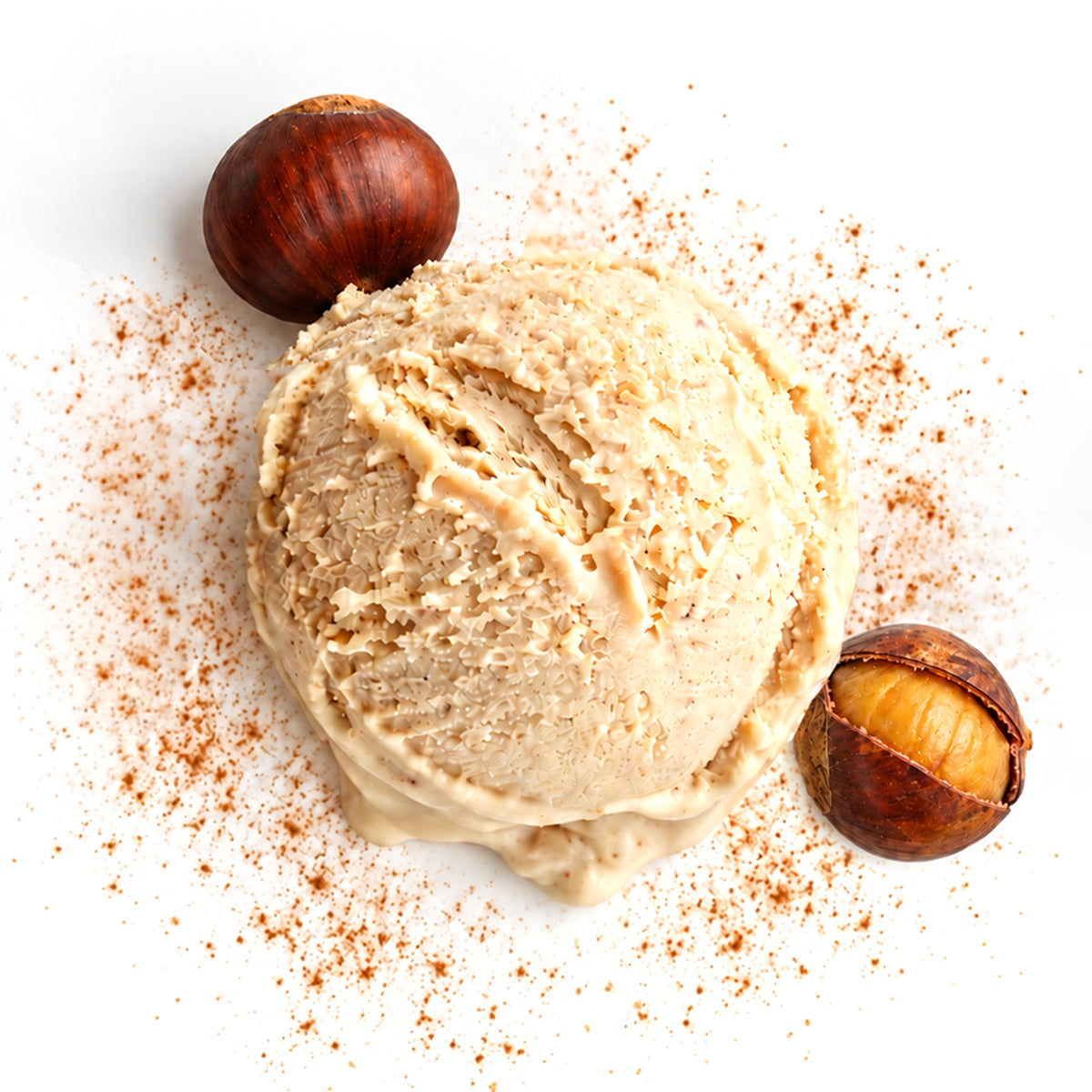 A scoop of Chestnut Spice ice cream centered on a white background, surrounded by scattered cinnamon powder, a whole chestnut, and a cracked half-chestnut.